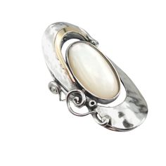 This stunning ring of Handcrafted Sterling Silver and gold, mother of pearl stone ring meticulously handcrafted in Israel for exceptional quality. Each piece is made to order with care and attention to detail.  MATERIAL & DIMENSIONS Metal: Sterling silver  Gemstone: Natural Mother of Pearl Dimensions:  Length: 35 mm / 1.1 in. Width:18 mm / 0.6 in CUSTOMIZATIONS: Explore our 14K Gold option for a luxurious upgrade.  Available in other gemstones for personalized style. RING SIZE: Custom-made to your precise size.  We recommend adding 0.5 size for wide rings SHIPPING: Made to order. Please allow 10-20 days for crafting and delivery Customer satisfaction is important to us; feel welcome to reach out with any questions or special requests. Pearl Stone, Hammered Ring, Wide Rings, Yellow Gold Ring, Pearl Ring, Stone Ring, Yellow Gold Rings, Rings Statement, Sterling Silber