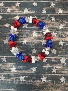 This is a Patriotic 4th of July bracelet. It would make a cute gift for the 4th of July. It would make a cute gift for a girl's Birthday. It would make a great addition to a young ladies 4th of July outfit. It has red, clear, and blue 8mm faceted beads. It has red, white, and blue tri beads. It was made with .8mm sturdy stretch string. I tie it several times to prevent breakage. It fits girls ages 6-9. It stretches to fit on the wrist. All items are ready to be shipped I do combined shipping. It Cheap Adjustable Beaded Bracelets For 4th Of July, Cheap Handmade Patriotic Bracelets, Patriotic Bracelet, Bracelets For Girls, Girls Bracelet, 4th Of July Outfit, Angel Bracelet, 4th Of July Outfits, Star Bracelet