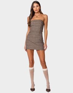 This Plaid Mini Dress With A Fold Over Neckline Adds A Touch Of Dimension To The Classic Silhouette. This Dress Is A Must-Have Addition To Any Wardrobe For Those Looking To A Simple Yet Classic Statement. Mini Dress. Fold Over Neckline. Lace Up Back Closure. Back Cut Out Detail. Plaid Pattern. 100% Polyester. Model Wears Size S. Model Height Is 5'9. Item Care: Machine Wash At Maximum 30ºc, Do Not Bleach, Do Not Tumble Dry, Iron At A Maximum Of 110ºc, Do Not Dry Clean. | Edikted Boss Mode Plaid Mini Dress Chino Pants Women, Plaid Mini Dress, Wwe T Shirts, Girls Graphic Tee, Girls Blouse, Swimsuit Cover Ups, Shoes With Jeans, Classic Silhouette, Dress Romper