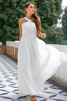 Do you want to look gorgeous, yet elegant and classic? Do you want to look like a Goddess? Look no further, you have found your dress. This beautiful white dress features a V line, halter neckline that goes on into a wrinkled bodice to accentuate your bust and ends up into a cinched waist with a wrinkled sash to adapt to your curves and give you a sexy hourglass shape, and it goes down into a beautiful long skirt. Be the most beautiful girl at prom and look like the Venus with this dress! Size C Long White Sleeveless Dress, Graduation Dress White Long, Casual White Dress Long, Long White Dress Formal, White Maxi Dress Formal, White Graduation Dress Long, Halter White Dress, White Maxi Beach Dress, Engaged Photos