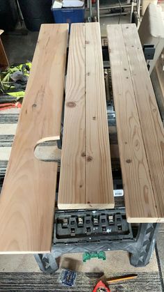 two pieces of wood sitting on top of a table