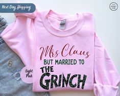 "Mrs. Claus but married to the Grinhc Sweatshirt, Funny Christmas, Womens Christmas, Gift for her, Grinhc Christmas Shirt, Christmas Couples ORDERING: 1. Review all photos 2. Choose Size and Color from drop-down menu 3. If personalization box is available, add your text color 4. Add each shirt to cart one at a time 5. Click \"Add to Cart\" - you can go back to add more products 6. Click \"Proceed to Checkout\" 7. Add note to seller for any requests * We use several different brand shirts, all of them are premium quality and soft shirts. The brands we send may vary depending on our stock situation. * We guarantee 100% satisfaction. The brands we use in- clude premium quality shirt brands such as Bella Canvas, Gildan Soft Style, Circle, Outlash. BULK DISCOUNTS AND SPECIAL REQUESTS: We offer Mr And Mrs Grinch Shirts, Christmas Bride Shirts, Mr And Mrs Christmas Shirts, Mrs Claus Married To The Grinch Shirt, First Christmas Married Tshirt, Womens Christmas Gift, Christmas Couples, Womens Christmas, Brand Shirts