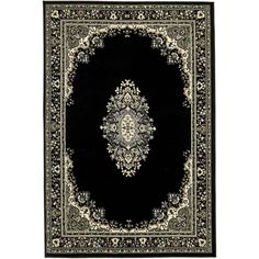 a black and white rug with an ornate design on the center, in front of a white background