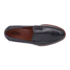 The Griffith loafer features an exquisite design with a stunning brogue detailing on the tongue and a classic slip-on style. Perfect for adding sophistication to any ensemble, the Griffith blends timeless elegance with ease of wear. Whether for a formal occasion or everyday functionality, these loafers ensure you look polished and refined with every step. Classic Black Slip-ons With Stitched Sole, Classic Black Plain Toe Slip-ons, Classic Black Slip-ons With Brogue Detailing, Classic Formal Wingtip Moccasins, Classic Slip-on Oxfords With Stitched Sole, Black Wingtip Slip-ons For Semi-formal Occasions, Formal Wingtip Moccasins With Rubber Sole, Classic Black Slip-on Tassel Loafers, Elegant Wingtip Moccasins With Rubber Sole