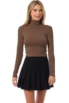 Long sleeve turtleneck crop top Model is wearing a size small Chic Fitted Turtleneck Cropped Sweater, Fitted Casual Cropped Mock Neck Top, Fitted Crop Top For Fall, Fitted High Neck Cropped Sweater, Trendy Fitted Crop Top For Fall, Spring Chic Turtleneck Crop Top, Stretch Turtleneck Crop Top, Trendy Brown Turtleneck Top, Casual Solid Turtleneck Crop Top