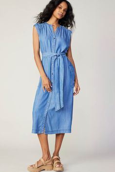 100% Tencel  Sleeveless v-neck button down midi dress with waist tie and large side pockets. Tie Waist Midi Dress For Day Out, Midi Dress With Tie Waist For Day Out, Spring Midi-length Belted Dress With Pockets, Knee-length Belted Dress For Day Out, Casual Belted V-neck Dress With Tie Waist, Casual V-neck Belted Dress With Tie Waist, Spring Casual Belted Dress With Tie Fastening, Casual Daywear Dress With Tie Fastening, Chic Mid-length Maxi Dress With Tie Waist