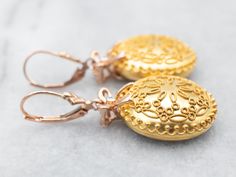 Bringing the mandala trend to your ears, these drop earrings are perfect for making any look complete! With an effortless mix of soft yellow and rose gold tones, these earrings are sure to add some serious zing to your style with their dazzling diamond accents!Metal: 10K Yellow Gold Earrings, 14K Rose Gold FindingsGem: 2 Diamonds totaling .02 Carats, SI in Clarity, I in ColorGem Measurements: 1.1 mm, RoundMeasurements: 20 x 39 mmMarks: "14K" "10K CN" Rose Gold Filigree Drop Earrings, Yellow Gold Earrings, Pocket Watch Chain, Soft Yellow, Watch Chain, Yellow Gold Earring, Bow Detail, Pearl Pendant, Charm Earrings