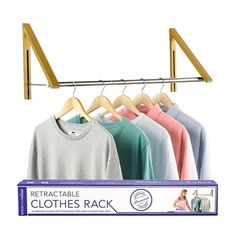 clothes rack with four shirts hanging on it