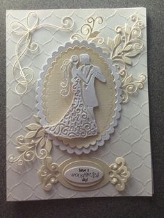 a wedding card with the silhouette of a bride and groom