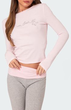 You'll feel extra dreamy in this stretchy cotton top designed with long sleeves and a rhinestone-embellished design at the front. Crewneck Long sleeves 95% cotton, 5% spandex Machine wash, dry flat Imported Pink Long Sleeve Top Outfit, Sleeve Top Outfit, Long Sleeve Top Outfit, Cotton Tops Designs, Pink Long Sleeve Top, Dream About Me, Visual Board, Pink Fits, Club Shirts