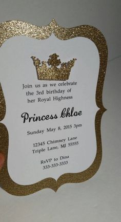 a hand holding up a princess birthday party card with gold glitter on the front and back