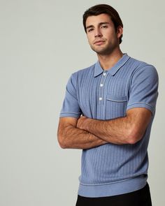 A pullover knitted sweater polo with complimentary contrast stitching at collar, pocket, sleeves, placket and bottom hem. Dress it up with a tailored jacked or keep it casual as you wear it solo. Details Models is 6'1" and wears a size medium. Care: Machine wash cold on delicate cycle with similar colors. Do not bleach. Do not tumble dry. Iron on low. Dry flat. Do not dry clean. Composition: 40% Viscose | 30% Recycled Polyester | 30% Nylon | 7DIAMONDS Men's Enzo Sweater Polo Shirt in Med Blue | Fitted Collared Polo Shirt With Pockets, Fitted Casual Polo Shirt With Pockets, Casual Polo Sweater With Ribbed Collar For Work, Blue Casual Polo Sweater With Polo Collar, Fitted Blue Polo Sweater With Short Sleeves, Collared Polo Sweater For Spring Business Casual, Blue Casual Polo Sweater, Fitted Short Sleeve Blue Polo Sweater, Fitted Blue Short Sleeve Polo Sweater