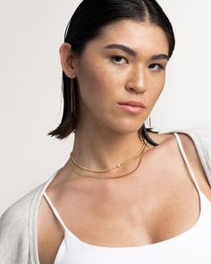 Toiny is the daintiest member of the Pearl Clash collection. An adjustable curb chain leads to its freshwater pearl center. She pairs just as well with A-line dresses as with a slinky crop top. Made from premium quality materials, st. Moran jewelry is designed to last. At our atelier, we believe in crafting jewelry to withstand every day wear without tarnishing. Crafting Jewelry, Hairstyling Products, Curb Chain Necklace, Rollerball Perfume, Makeup Bronzer, Embellished Denim, Gold Pearl Necklace, Beauty Sale, Fragrance Design