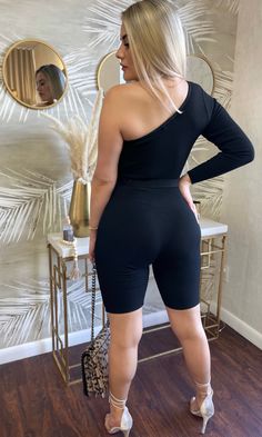 Stretch romper One shoulder Long sleeve Ribbed Belt included 90% rayon 10% spandex Runs true to size Model is wearing a size small Model is 5.3" 135 lbs Model is using 4" heels 135 Lbs, Sleeved Romper, Black Romper, Black Rib, Fashion Boutique, Phone Numbers, The Black, Night Out, One Shoulder