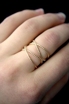 This is a gorgeous, trend-setting ring made of thick, twisted 14K Gold-fill metal. I wrap a length of 14k Gold-fill around four times and securely solder it around back. The twisted detail of this ring creates an eye-catching, unique texture. The beauty of this ring lies in its organic shape. I can never create the same wrapped effect twice, which means that every ring I make will be totally unique and individual to you. This ring will look slightly different from every angle.These rings make gr Criss Cross Ring, Woven Ring, Twisted Metal, Gold Wrap, Stacking Ring Set, Stack Ring, Wrap Ring, Twist Ring, Cross Ring