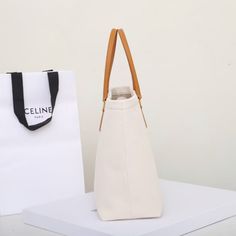 Size: 44cm*32cm*6cm It comes with Dust box, Care manual, Tag, and Paper bag. Large Capacity Rectangular Canvas Shopping Bag, Square Canvas Bag With Top Carry Handle For Errands, Minimalist Rectangular Bucket Bag For Errands, Minimalist Rectangular Bags For Errands, Minimalist Rectangular Hobo Bag For Shopping, Rectangular Minimalist Hobo Bag For Shopping, Large Capacity Square Canvas Box Bag, Large Modern Beige Bag, Large Capacity Canvas Box Bag For Shopping