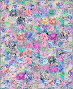 a patchwork quilt with flowers and leaves on the front, in shades of blue, pink