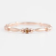 * Band width: ≈1.75mm * Setting size: ≈2mm * Diamond size: ≈1.5mm (≈0.02ct) * Material: 14k solid gold * Made of 100% recycled precious metal and ethically sourced gemstone * Comes in a gift box with a bow ready for gifting * Handmade with love and great care in New York *Please make sure you check the size using Ring Size Guide. *Due to the nature of handmade pieces each jewelry might have slight variations. Colors may look slightly different depending on screen and lighting. Items might appear Stack Rings Diamond, Stackable Birthstone Rings, Stack Rings, Diamond Stacks, Diamond Stacking Rings, Diamond Solitaire Ring, Rings Diamond, Brown Diamond, Unique Ring