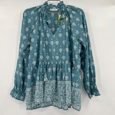 Roller Rabbit Women's Tashi Border Jannella Top - New With Tags Color: Teal Blue/White Size: Small Retail: $148 Tunic Blouse Split, V-Neckline Drawstring Tassel Detail At Neck Long Blousson Sleeve Ruffled Cuff Cinched Waist Tashi Border Print Relaxed Fit 100% Cotton 19.5" Pit-To-Pit 25.5" Long Light Blue Printed Long Sleeve Blouse, Light Blue Long Sleeve Printed Blouse, Blue Tunic Tops For Fall, Indigo Long Sleeve Bohemian Top, Blue Relaxed Fit Tunic Blouse, Light Blue Long Sleeve Bohemian Blouse, Light Blue Bohemian Top For Fall, Blue Boho Print Top For Fall, Blue Boho Print Tops For Fall