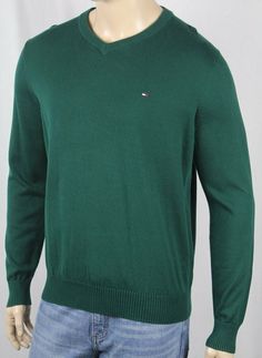 Tommy Hilfiger Green V Neck Cotton Long Sleeve Sweater NWT ~*~*Tommy Hilfiger*~*~ ~*~*New With Tags*~*~ This gorgeous crew neck sweater is by Tommy Hilfiger. In a fabulous Green 100% cotton, this sweater features a handsome v neck neckline. The sleeves are long and have ribbed cuffs. A Tommy Hilfiger Logo is embroidered on the chest,  and finishes this sweater off quite nicely.   Small Medium Large X-Large XX-Large ARMPIT TO ARMPIT 20.5" (52.1 cm) 22” (55.9 cm) 23.5” (59.7 cm) 25” (63.5 cm) 27” Casual Green Tommy Hilfiger Tops, Classic Green Long Sleeve Sweater, Green Stretch Crew Neck Sweater, Casual Solid Color Crew Neck Sweater, Tommy Hilfiger Long Sleeve Sweater For Spring, Tommy Hilfiger Cotton Sweater For Fall, Green Crew Neck Sweater For Layering, Tommy Hilfiger Fall Sweater With Ribbed Cuffs, Tommy Hilfiger Sweater With Ribbed Cuffs For Fall