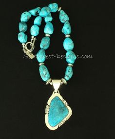 This terrific Necklace showcases a Kingman Turquoise and Sterling Silver Pendant by Nevada Silversmith Jim Daggett. The high-grade Kingman stone is rich blue with gray matrix, and shows slight traces of Pyrite which flash in the light. The Turquoise is wrapped in a handcrafted Bezel which has been cut in a sawtooth pattern along the top edge, and set on Sterling Silver Sheet which has been shaped to match the stone. The Sterling Sheet has been decoratively notched in 3 places, adding style and d