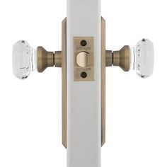 an image of a door handle with two glass knobs on the front of it