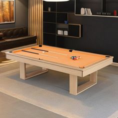 a pool table in the middle of a living room