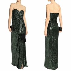 a woman in a long green dress with sequins on the back and side