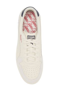 This throwback sneaker emerges from the '80s archives and maintains its sleek silhouette thanks to premium materials and a sporty, low-profile design. Lace-up style Leather upper/textile lining/rubber sole Imported Cream Sneakers With Perforated Toe Box For Streetwear, High-top Cream Sneakers With Perforations, Sporty Cream Sneakers With Perforations, Sporty Cream Sneakers With Perforated Toe Box, Cream Athleisure Sneakers For Streetwear, Sporty Cream Sneakers With Rubber Waffle Outsoles, Cream Lace-up Athleisure Sneakers, Retro Low-top Sneakers With Perforations, Cream Sneakers With Perforated Toe Box For Sports