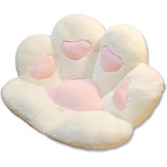 a white stuffed animal with pink hearts on it