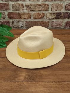 Handmade Panama Hat and Removeable ~ Yellow ~ Accessory Band The band is interchangeable and can be removed to reveal a plain dark band underneath (dark band fixed to hat). The removeable band is elasticated and will stretch for different size hats. ~ Genuine Panama hat handwoven with Toquilla palm ~ ~ Handwoven in Ecuador ~ ~ Natural Panama ~ ~ Possible to roll for easy travel ~ ~ Inside comfort band ~ Other colour Panama hats and bands available from our store > https://www.etsy.com/shop/perso Yellow Accessories, Easy Travel, Other Colors, Elastic Band, Panama Hat, Panama, Caps Hats, Accessories Hats, Hand Weaving