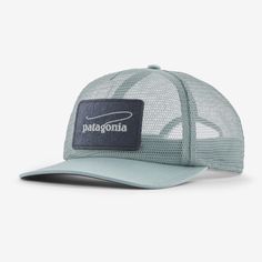 the patagonia trucker hat in light blue and grey with a patch on the front