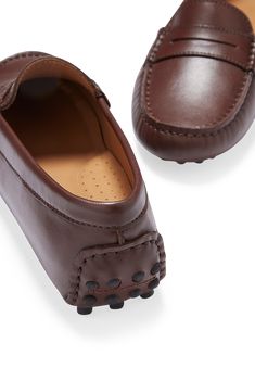 Hugs & Co. brown leather penny loafer driving shoes for women. Moccasin style driving loafers in luxurious brown outer and lined with a soft leather for extra comfort. Made in Portugal MATERIAL 100% leather upper featuring a 100% leather Liningrubber studded sole Luxury Brown Slip-on Moccasins, Brown Luxury Loafers With Leather Footbed, Luxury Brown Loafers With Leather Footbed, Brown Calf Leather Loafers For Driving, Brown Calf Leather Driving Loafers, Luxury Brown Moccasins With Round Toe, Elegant Brown Driving Moccasins, Brown Calf Leather Plain Toe Moccasins, Brown Calf Leather Moccasins With Plain Toe