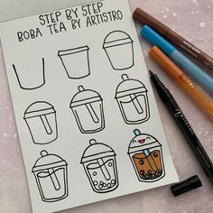 some markers and pens are sitting on top of a sheet of paper with coffee cups