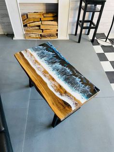 a wooden table sitting on top of a tiled floor