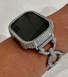 "Fits Apple Watch in size 49mm Ultra 1 or 2.    This is a custom Iwatch Candy Apple Watch Band in Silver set with Pave Swarovski Crystal in a luxury Alloy Metal with a jewelry style fold over closure and or Poly Carbonate Silver Metallic Case studded with pave Swarovski Crystals. Easy snap on case with access to all buttons.The sparkle on this band is amazing.  Can be adjusted to fit wrist sizes from 6.35\" to 8.5\".  Easy to resize no tool need, comes with instructions.  Please measure your wri Apple Watch Cover, Mens Bling, Apple Watch Bands Women, Bracelet Apple Watch, Apple Watch Case, Apple Watch Accessories, Swarovski Crystal Bracelet, Jewelry Style, Candy Apple