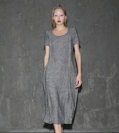 A cool linen dress is an absolute must-have in any woman's wardrobe. The loose-fitting style of this gray dress will give you not only comfort but also a fabulous silhouette no matter what size you are. Whether you decide to wear this dress for lounging around the house or at the office, you'll know that you'll be able to keep cool. Anyone who has experienced the coolness of wearing cool linen fabric would never want to not own linen clothing. This is especially true when it comes to women's dre Gray Shift Dresses For Summer, Fitted Gray Casual Dress, Gray Knee-length Midi Dress For Summer, Gray Knee-length Summer Midi Dress, Gray Fitted Short Sleeve Maxi Dress, Casual Long Dress For Workwear, Spring Gray Shift Dress, Casual Gray Knee-length Dress, Fitted Short Sleeve Linen Dress For Work