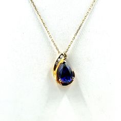 "Darling 14K yellow gold pendant with a blue sapphire and diamonds.  Marked 14K.  20 inch adjustable length 10K yellow gold chain included!  Marked 10K.  A wonderful gift or addition to your personal jewelry collection. FREE SHIPPING! Details:  14K and 10K Yellow Gold: (as shown in picture) Sapphire: (10) 9.5 mm x 6.3 mm pear Gem Color: Blue Diamond: (3) 1.5 mm round Approximate Total Diamond Weight: .05 carats Diamond Clarity: SI Diamond Color: H Approximate Pendant/Brooch Dimensions: 5/8 inch x 3/8 inch Chain Length: 20 inches (adjustable) Total Weight (together): 2.6 grams FREE domestic shipping by USPS Priority Mail delivery confirmation and includes insurance. If the item is to be shipped internationally Etsy will calculate postage. Please notify us at purchase if you are buying more Gold Sapphire Jewelry Stamped 14k, Blue Teardrop Pendant Jewelry With Diamond Accents, Blue Teardrop Pendant With Diamond Accents, Sapphire Jewelry Stamped 14k For Gift, Blue Diamond Jewelry Stamped 14k, 14k Gold Jewelry With Blue Diamond Accents, 14k Gold Blue Jewelry With Diamond Accents, 14k Gold Jewelry With Diamond Accents In Blue, Gold Sapphire Necklaces With Diamond Accents