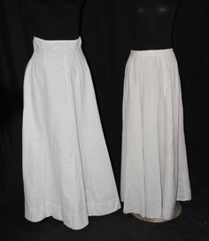 "TWO PLAIN LONG LINEN SKIRTS, LATE 1920s This lot contains two linen skirts dating to the late 1920s and early 1930s. All have recently been laundered and pressed. LEFT TO RIGHT THE LEFT SKIRT White linen plain skirt with multiple panels to produce fullness. High Waist. Back metal closure using  5 snaps and 6 hook and eyes. Unlabeled. CONDITION Very Good.  No holes, no repairs , has stain on lower back, and has been laundered and pressed. APPROXIMATE MEASUREMENTS Waist: 33\", narrows to 31\", 3- Fitted Linen Formal Skirt, Classic Cotton Skirt For Daywear, Fitted Linen Skirt For Formal Occasions, Formal Fitted Linen Skirt, Fitted Lined Bottoms For Daywear, Fitted Vintage Linen Bottoms, Linen Fitted Skirt For Daywear, Fitted Linen Skirt For Daywear, Fitted Full Length Skirt For Daywear