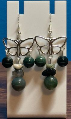 Beautiful moss agate dangle earrings. Made with sterling silver earwire and comes with earring backs. Be sure to check out the matching necklace and bracelet! I take pride in my work so if there are ever any problems with this piece, please let me know so we can get it fixed! I make one of a kind jewelry that will stand out! Will ship Quickly!! Handmade Agate Dangle Jewelry, Spiritual Agate Dangle Jewelry, Agate Drop Earrings Gift, Agate Drop Earrings As A Gift, Agate Drop Earrings For Gift, Agate Drop Earrings With Matching Set, Trendy Agate Drop Earrings, Hypoallergenic Agate Round Beads Jewelry, Unique Agate Jewelry With Matching Earrings