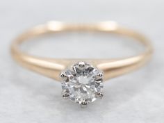 This engagement ring is simple and traditional, with a gently tapered shank and shoulders, and an angular six-prong head. A beautiful platinum head holds the diamond, really accenting the stone, and gently transitions into a sleek and beautifully polished yellow-gold shank! Timeless and elegant!Metal: 14K Yellow Gold, Platinum Gem: Diamond .36 Carats, H in Color, I1 in Clarity Gem Measurements: 4.7 mm, Round Ring Size: 6.50Marks: "PLATINUM" Stamped on the inside band Solitaire Engagement Ring Round, Traditional Engagement Ring, Classic Diamond Engagement Ring, Engagement Ring Round Cut, Engagement Ring Solitaire, Engagement Ring Round, Filigree Pendant, Rose Gold Band, Round Rings