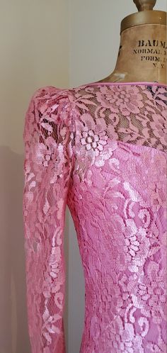 Absolutely pristine vintage 1960's Pink Satin Mermaid Dress with Lace Overlay! This piece is unique in so many ways & I can honestly say I've never seen anything like her. The color is will stop you in your tracks! Vibrant doesn't even being to describe the saturation of the pink in the satin & lace. The dress can be worn with or without the lace overlay - 2 dresses in 1! The dress is made of a silky satin fabric that transitions into a matching lace mermaid skirt that is cut in the high low silhouette. Featuring delicate spaghetti straps, v neck / sweetheart neckline, & vintage Talon zipper down the center back. The lace overlay completes the lace detailing by connecting with the lace mermaid skirt for a full lace look! The lace overlay attaches with hook and threaded eye closures down th Retro Vintage Long Sleeve Dress For Party, Retro Long Sleeve Vintage Dress For Party, 1950s Style Fitted Party Dress, Fitted Vintage Dress For Vintage Events, Retro Stretch Dress For Party, Fitted Vintage Dress For Spring Party, Retro Lace Vintage Dress For Party, Vintage Lace Dress For Party In Retro Style, Vintage Long Sleeve Dress For Party