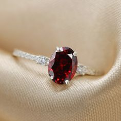 Beautifully handmade Garnet ring. The perfect cocktail ring set with a red gemstone and simulant diamonds Elegant, classy and vintage inspired. Available in Gold plating, Rose Gold plating and in Sterling Silver ☆ WHY THIS PIECE OF J E W E L R Y IS AWESOME! ☆ * Hand finished and made from high quality raw materials. * Long lasting beauty & Timeless design * Beautifully made, hand finished, Fast shipping with tracking amazing after sales service if needed. * Garnet oval cut 8x6 mm 1.25 ctw wi Ring For Women Silver, Red Gemstone Ring, Garnet Engagement Ring, Ruby Engagement Ring, Diamond Gift, Etsy Gold Ring, Textured Ring, Red Gemstones, Oval Ring