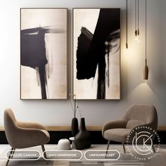 two black and white paintings hang on the wall in a modern living room with chairs