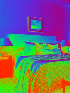 an image of a bed with pillows and blankets in the same color as it appears to be infraredized