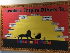 a bulletin board with the words leaders inspire others to, including lion and person on it