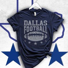 a t - shirt with the words dallas football on it and three stars around it