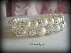 Bridal cuff bracelet Swarovski white or ivory by Element4you, $35.00 Adjustable Pearl Embellished Bracelet For Wedding, Cream Beaded Bracelets For Wedding, Wedding Pearl White Beaded Bracelets, Adjustable Pearl Crystal Wedding Bracelet, Pearl Crystal Bracelet For Wedding With Round Beads, Cream Pearl Bracelet With Round Beads For Wedding, Adjustable Pearl Wedding Bracelet, Adjustable Pearl Crystal Bracelet For Wedding, Pearl Crystal Bracelet For Wedding