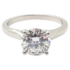 a white gold ring with an oval cut diamond