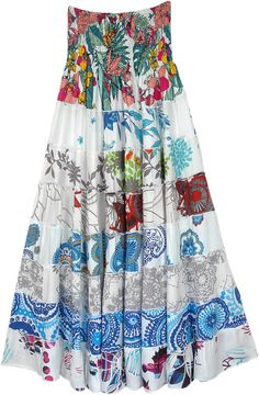 A serene white classy skirt with mixed floral and ethnic prints with a soft smocking waist.  This is a two-in-one skirt and a dress. #tlb #TieredSkirt #vacationclothing #beachwrap #Floral #Printed #Tieredskirt #Smockedskirt #Rayonskirt #Skirtdress White Flowy Floral Print Maxi Skirt, White Lined Vacation Dress, White Floral Print Tiered Skirt, White Bohemian Lined Maxi Skirt, White Flowy Maxi Skirt With Floral Print, Bohemian White Lined Maxi Skirt, Bohemian White Maxi Skirt With Gathered Detail, Bohemian White Gathered Maxi Skirt, White Bohemian Dress With Gathered Skirt